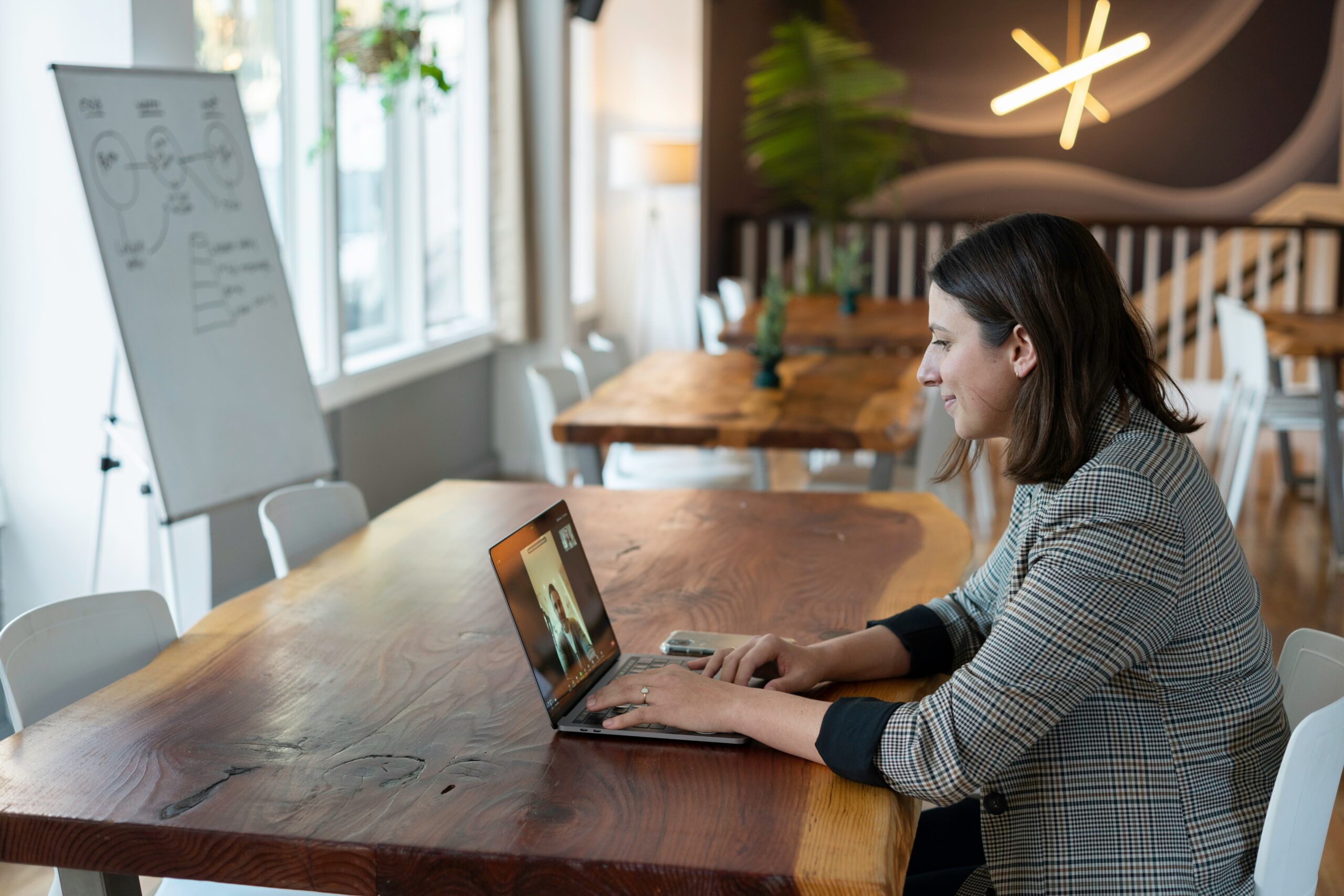 Businesswoman participating in an online meeting, showcasing Catapultk’s expertise in Kantata SX solutions for remote collaboration.